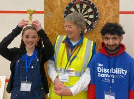 President Niki Little presenting prizes at the darts competition in April 2026